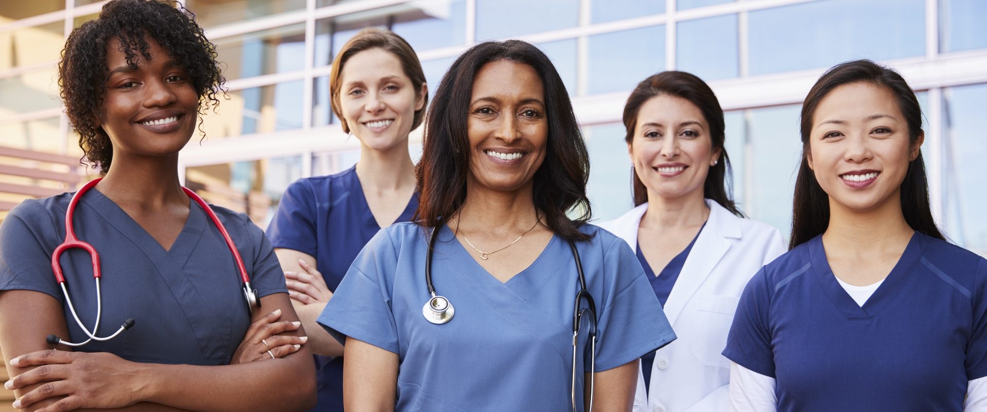 https://best-nursing.com/wp-content/uploads/2016/09/female-healthcare-colleagues-standing-outside-497PNLK-1-e1646664243684.jpg